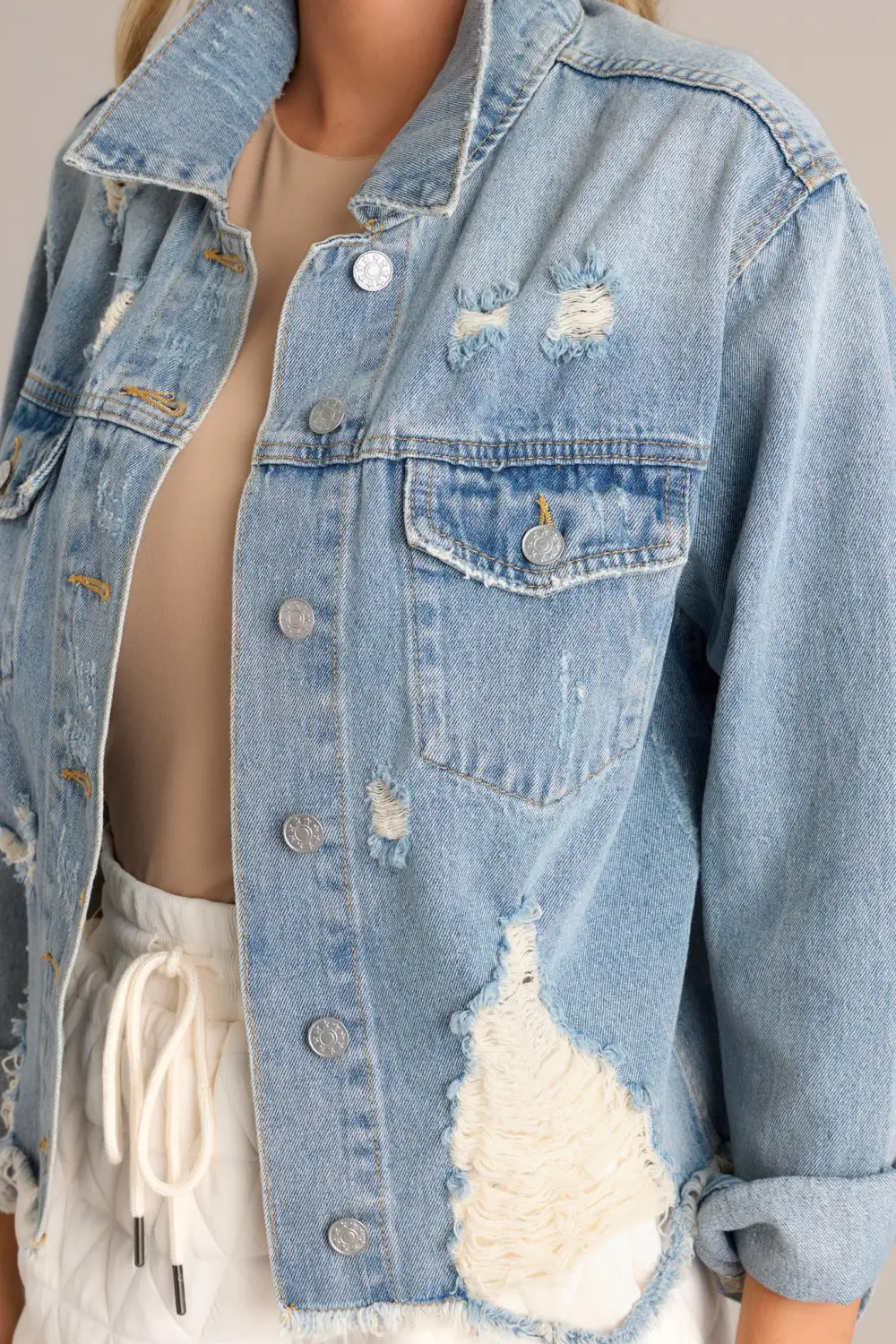 DARING IN THIS MEDIUM WASH DISTRESSED DENIM JACKET