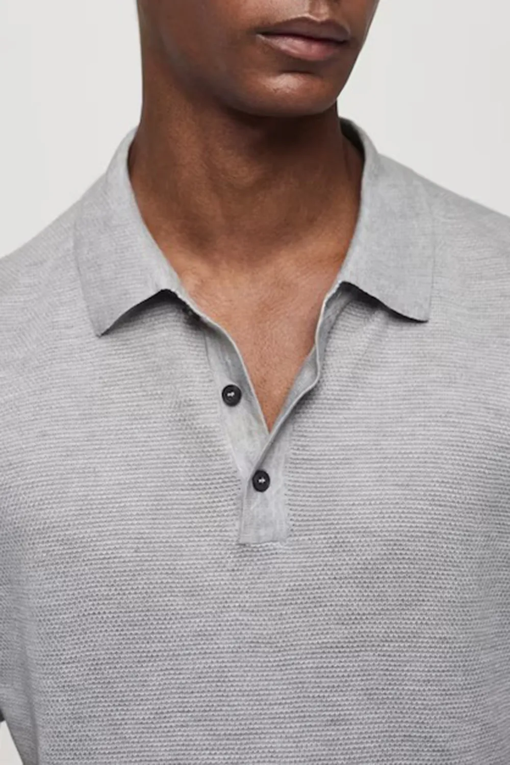 Buttoned micro-structure knitted polo shirt